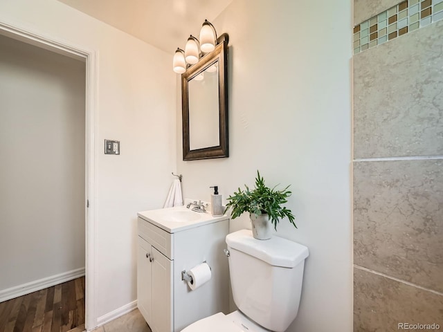 4418 W 11th Ave, Denver, CO 80204 - bathroom featuring vanity and wood finished floors