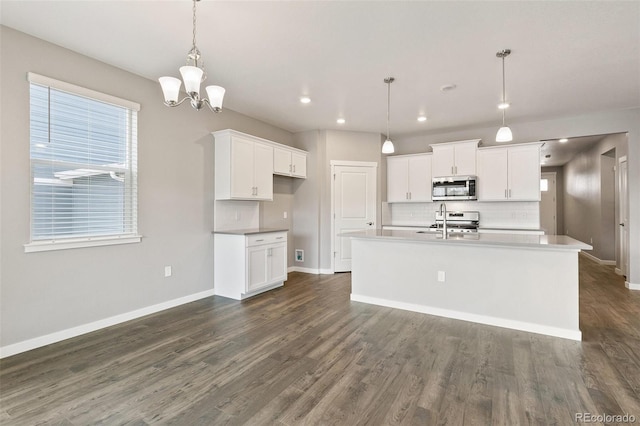 14259 Beebalm Ave, Parker, CO 80134 - kitchen with stainless steel appliances, baseboards, dark wood-type flooring, tasteful backsplash, and white cabinetry