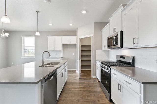 14259 Beebalm Ave, Parker, CO 80134 - kitchen with stainless steel appliances, a sink, dark wood-type flooring, backsplash, and recessed lighting