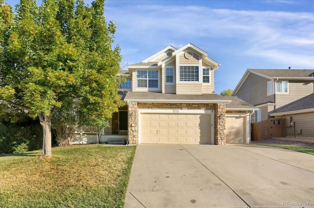 view of front of house featuring a front yard and a garage