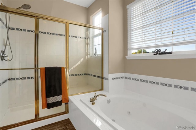 bathroom featuring hardwood / wood-style floors and independent shower and bath