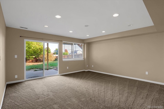 spare room featuring carpet flooring