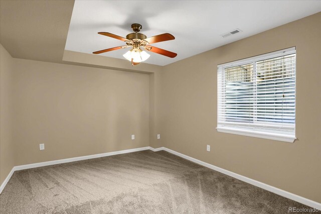 empty room with carpet and ceiling fan