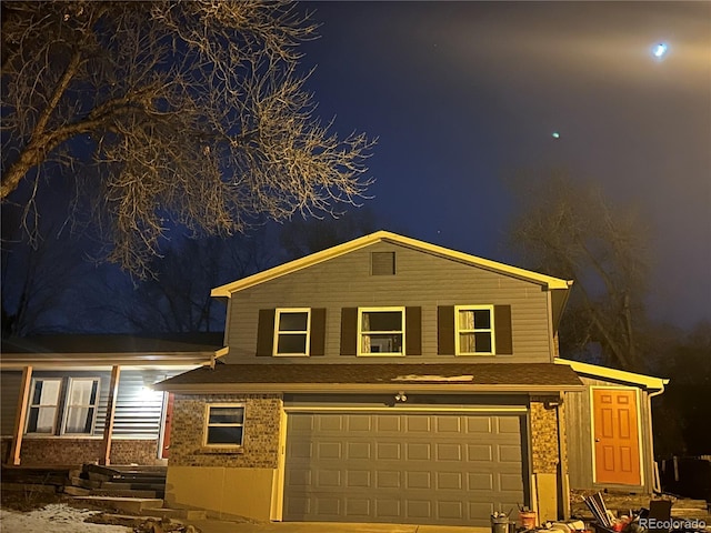 view of front of property with a garage