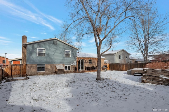 view of snow covered house