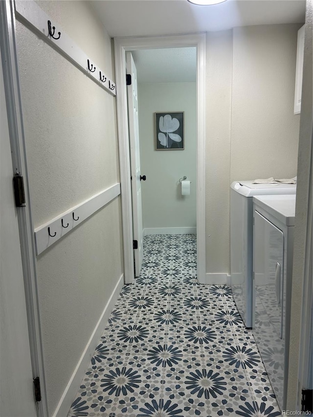 clothes washing area featuring washing machine and clothes dryer