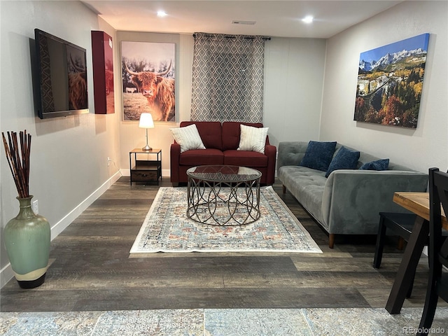 living room with dark hardwood / wood-style flooring