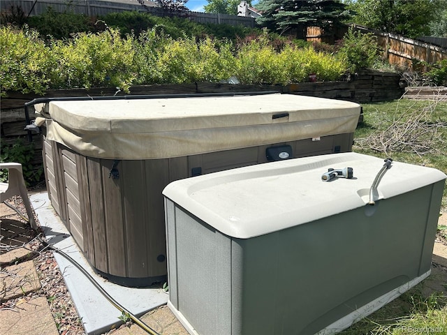 exterior space with a hot tub