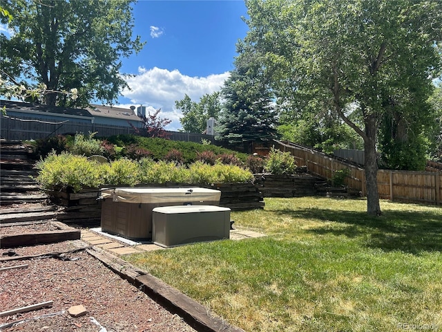 view of yard with a hot tub