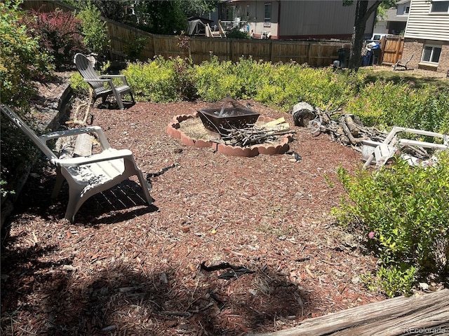 view of yard featuring an outdoor fire pit