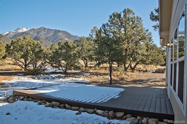 exterior space featuring a deck with mountain view