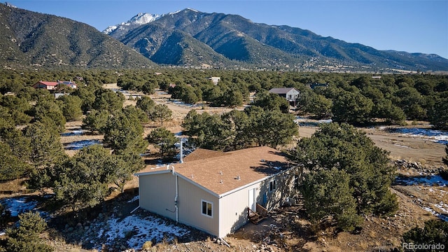 drone / aerial view featuring a mountain view