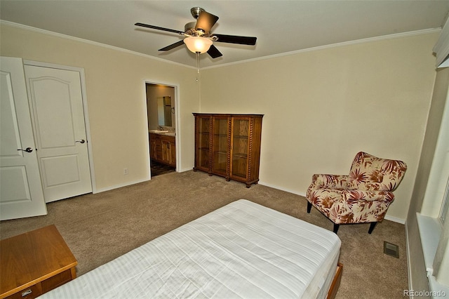 bedroom featuring ceiling fan, ensuite bathroom, crown molding, and carpet