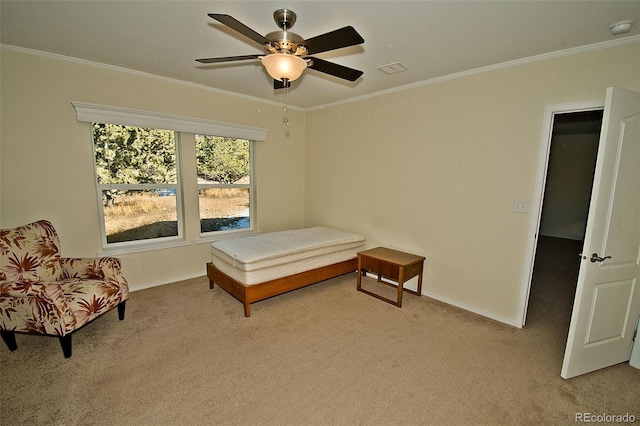 bedroom featuring light carpet, ceiling fan, and crown molding