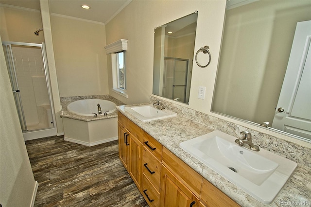 bathroom with wood-type flooring, vanity, ornamental molding, and plus walk in shower