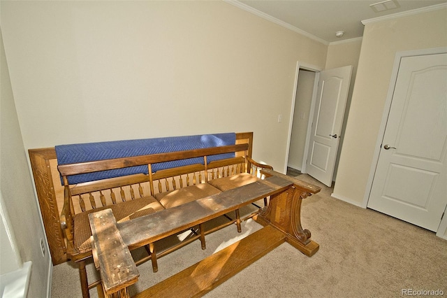 bedroom with light carpet and crown molding