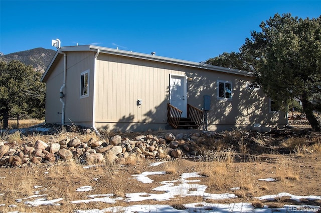 rear view of house with a mountain view