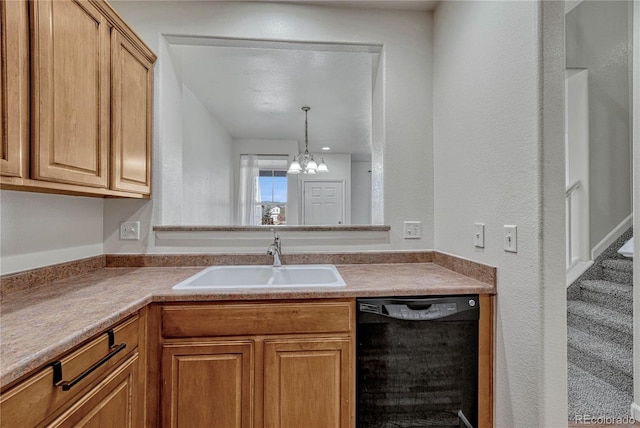 kitchen featuring dishwasher, pendant lighting, a notable chandelier, and sink