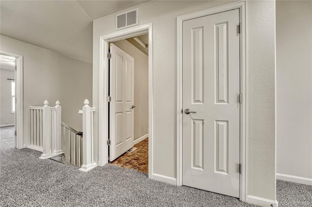 hallway with carpet