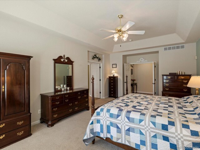 5700 S Benton Cir, Littleton, CO 80123 - bedroom featuring light carpet, a tray ceiling, and ceiling fan