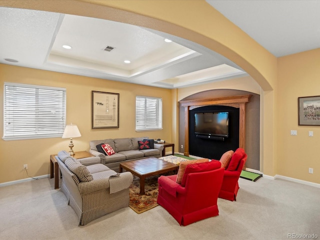 5700 S Benton Cir, Littleton, CO 80123 - living room featuring arched walkways, a raised ceiling, carpet floors, baseboards, and recessed lighting
