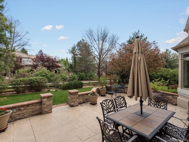 5700 S Benton Cir, Littleton, CO 80123 - view of patio / terrace with outdoor dining space and fence