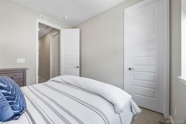 carpeted bedroom with visible vents