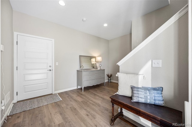 foyer entrance with baseboards, recessed lighting, and wood finished floors
