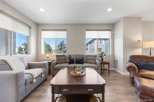 4265 E Iliff Ave Unit 1, Denver, CO 80222 - living room with recessed lighting, baseboards, and light wood-type flooring
