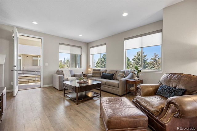 4265 E Iliff Ave Unit 1, Denver, CO 80222 - living room featuring plenty of natural light, recessed lighting, light wood finished floors, and baseboards