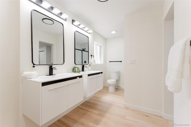 1361 W Custer Pl, Denver, CO 80223 - full bath featuring vanity, wood finished floors, and a shower