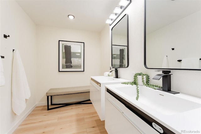 1361 W Custer Pl, Denver, CO 80223 - full bath with wood finished floors, vanity, and recessed lighting