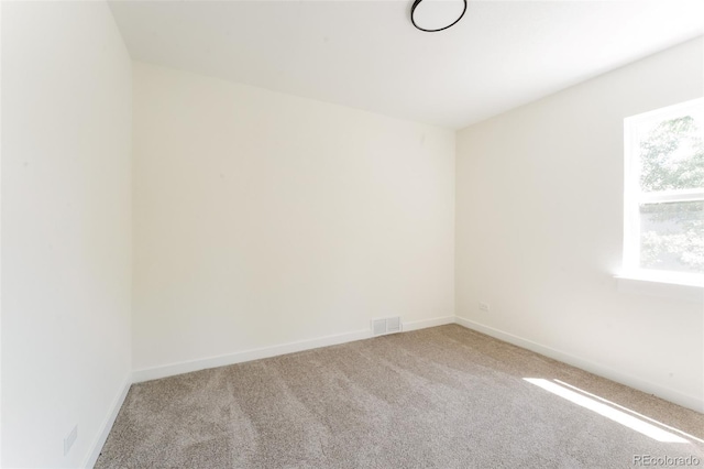 1361 W Custer Pl, Denver, CO 80223 - carpeted spare room featuring baseboards