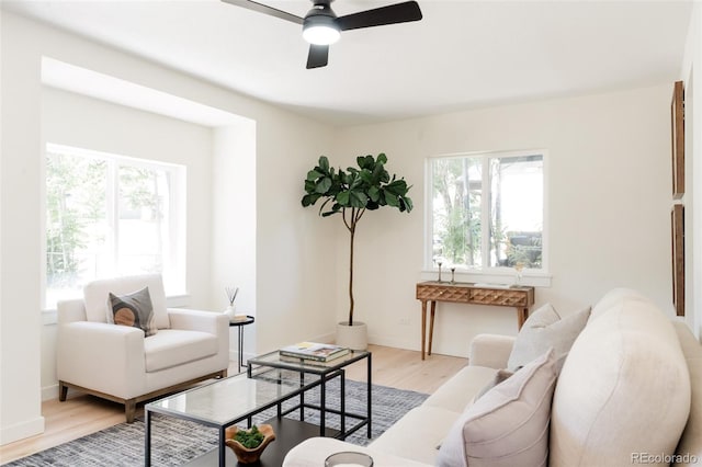 1361 W Custer Pl, Denver, CO 80223 - living room featuring light wood-style floors, plenty of natural light, and a ceiling fan