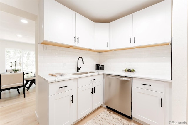 1361 W Custer Pl, Denver, CO 80223 - kitchen featuring stainless steel dishwasher, light wood-style floors, white cabinetry, and recessed lighting