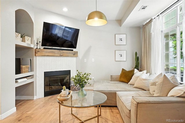 1325 W 112th Ave Unit B, Westminster, CO 80234 - living area featuring wood finished floors, a fireplace, and recessed lighting