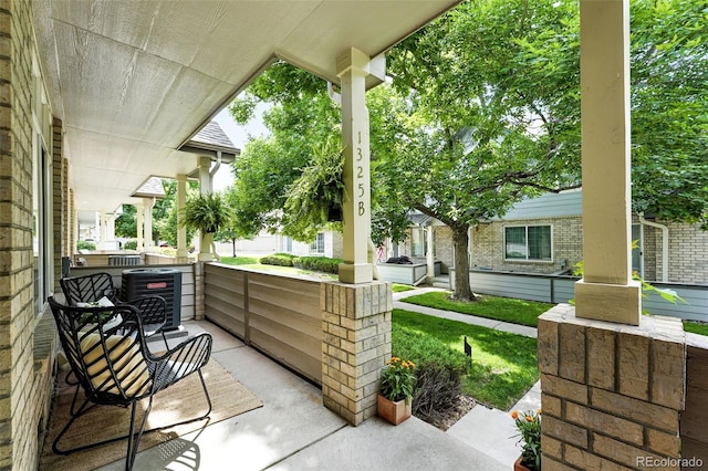1325 W 112th Ave Unit B, Westminster, CO 80234 - covered porch featuring a lawn