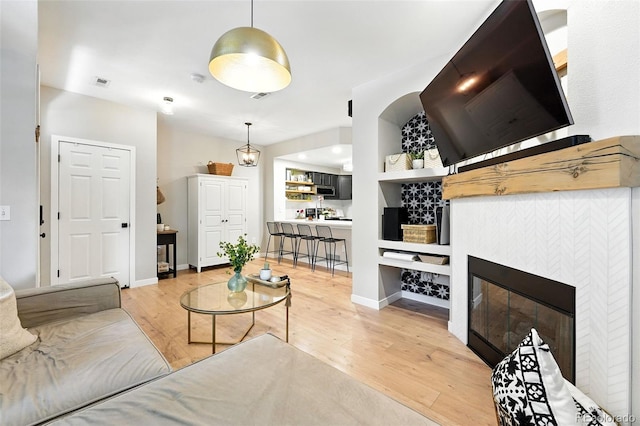 1325 W 112th Ave Unit B, Westminster, CO 80234 - living room with wood finished floors and a fireplace