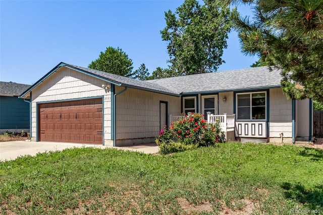 3735 S Lewiston St, Aurora, CO 80013 - ranch-style house with a garage, a porch, a front yard, and concrete driveway