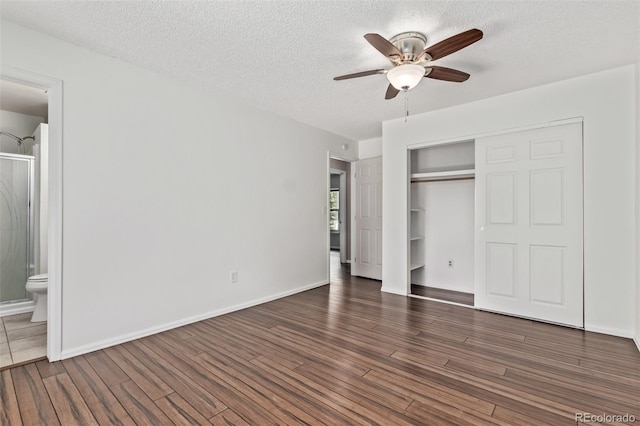 3735 S Lewiston St, Aurora, CO 80013 - unfurnished bedroom with a textured ceiling, wood finished floors, a closet, connected bathroom, and a ceiling fan