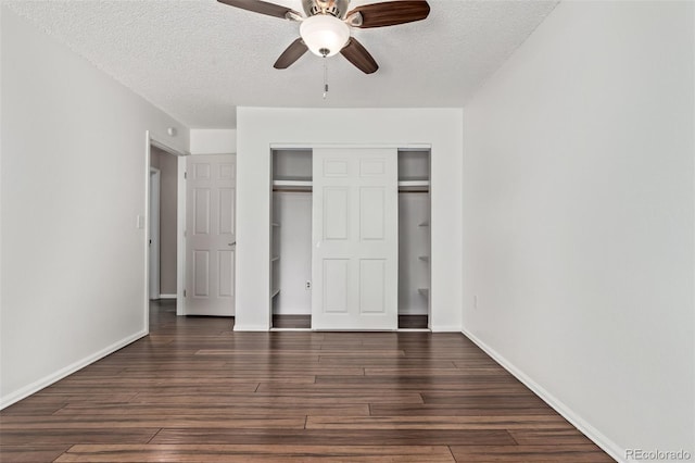 3735 S Lewiston St, Aurora, CO 80013 - unfurnished bedroom with dark wood-type flooring, a textured ceiling, a closet, and ceiling fan
