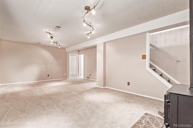 3735 S Lewiston St, Aurora, CO 80013 - carpeted spare room with a textured ceiling and stairway