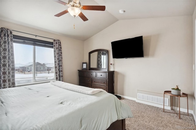 bedroom with ceiling fan, lofted ceiling, and carpet