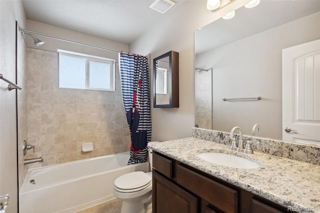 full bathroom with toilet, vanity, shower / bath combo with shower curtain, and tile patterned flooring