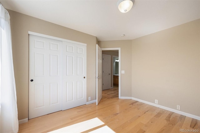 6833 E 115th Ave, Thornton, CO 80233 - unfurnished bedroom featuring light wood-style flooring and a closet