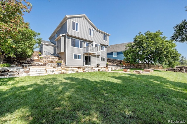 6833 E 115th Ave, Thornton, CO 80233 - rear view of house with a balcony and a patio area