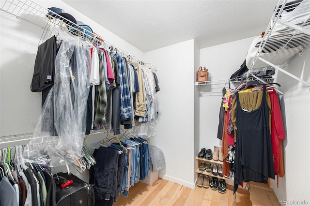 6833 E 115th Ave, Thornton, CO 80233 - walk in closet featuring wood finished floors