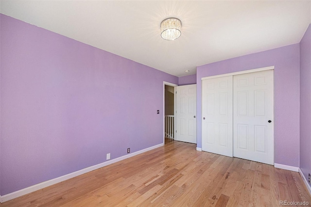 6833 E 115th Ave, Thornton, CO 80233 - unfurnished bedroom with light wood finished floors and a closet