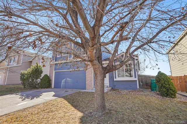 view of front facade with a garage and a front lawn