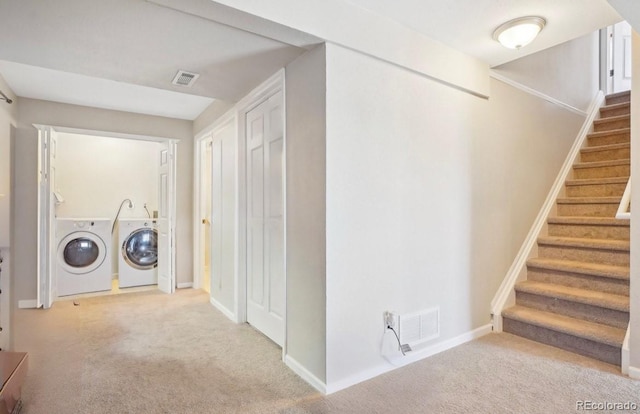 laundry room featuring carpet floors and independent washer and dryer